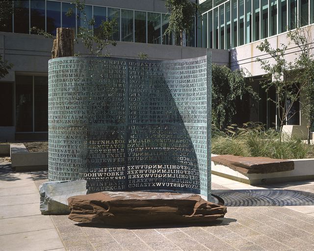 Kryptos (copper screen, petrified wood, granite and pool)