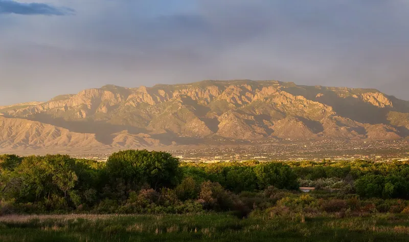 The Sandia Mountains above Albuquerque at sunset, with the city at their foot