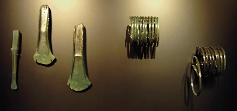 Two flanged axes, a chisel (HK 2002:1649 b) and two spiral arm rings: photo